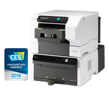 RICOH Ri 100 with optional textile finisher in a compact dual system – excellent DTG printer for beginners, awarded with the CES Innovation Award 2018